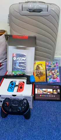 Nintendo Switch console bundle with Joy‑Con, Pro controller, games and travel case