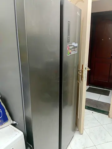 Large stainless steel side-by-side refrigerator - good working condition