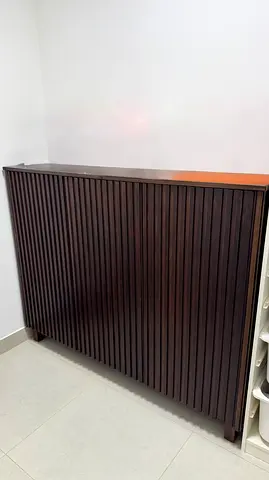 Dark wood shoes cabinet
