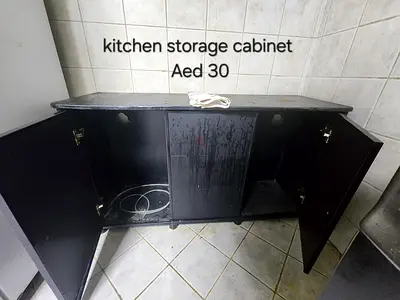 Used black kitchen storage cabinet - 3-door, good for pantry or utility