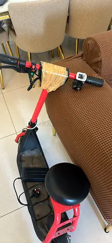 Red electric scooter with seat - used, working condition
