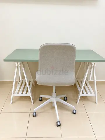 IKEA Minimalist green desk with white trestle legs and swivel office chair