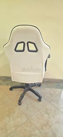 White ergonomic gaming/office chair with wheels — used