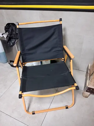 Foldable Outdoor Camping Chair with Black Fabric and Light Frame