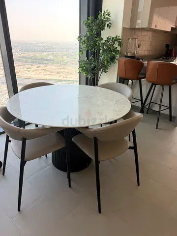 Marina marble dining table 47 inches x. 29 inches and light grey leather chairs x 4 22 x 31 inches