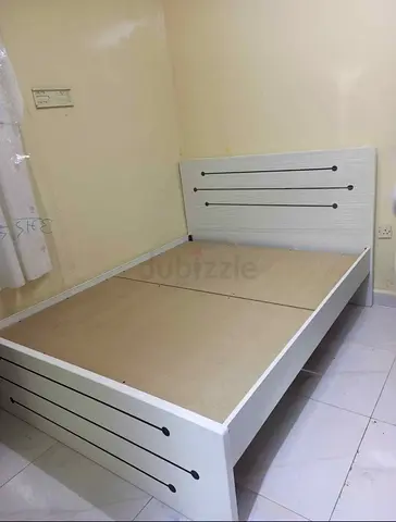 White wooden double bed frame with headboard - good condition
