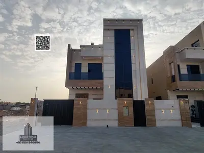 Villa for sale in Ajman, Al Helio area. 5 master bedrooms, majlis, living room, and maid's room. Bank financing available.