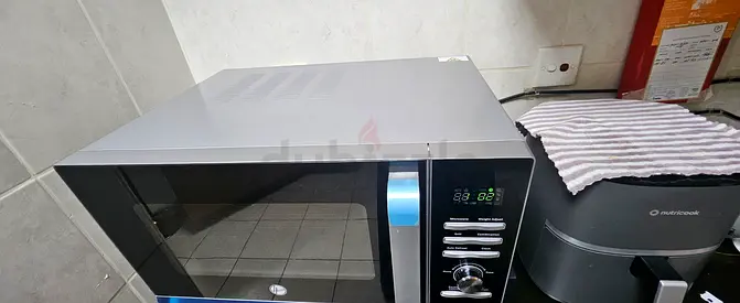 URGENT- MOVING  OUT SALE HOOVER Countertop Microwave - Excellent Working Condition