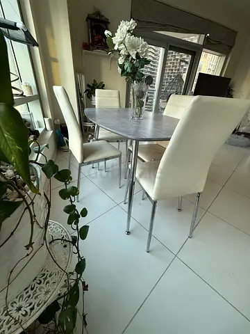 Modern round dining table with 4 white chairs - good condition