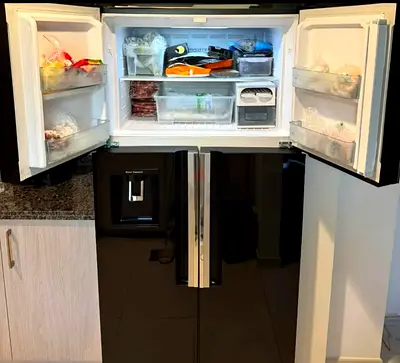 Hitachi 4-Door Refrigerator – Black Glass Finish Stylish and spacious Hitachi refrigerator in a sle