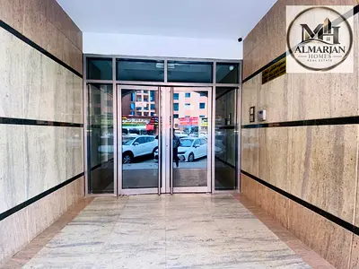 Two-bedroom apartment with a living room, featuring built-in wardrobes and central air conditioning