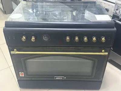 Used freestanding gas range with oven - vintage black and brass finish