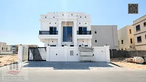 Villa for sale in Al Bahya, Ajman. Features 6 master bedrooms, a majlis, 2 living areas, a maid’s 