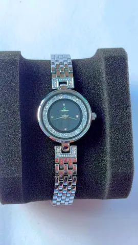 Women's silver Guess analog watch with crystal bezel.