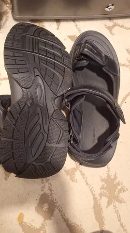 Men's black outdoor sandals, size not specified — lightly used