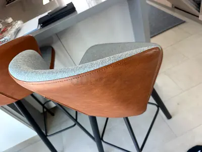 Set of 2 modern counter-height bar stools — faux leather back, fabric seat, metal legs