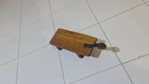 Small wooden coconut scrapper