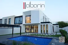 Luxury villa for sale in Al Zorah, 6,000 square feet, with a private swimming pool and garden.