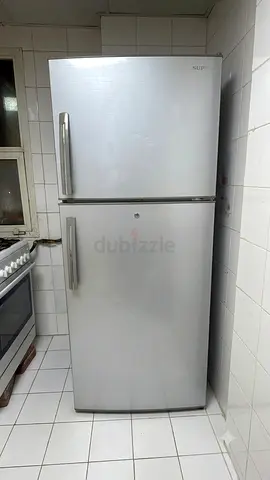 Silver double-door refrigerator, good working condition