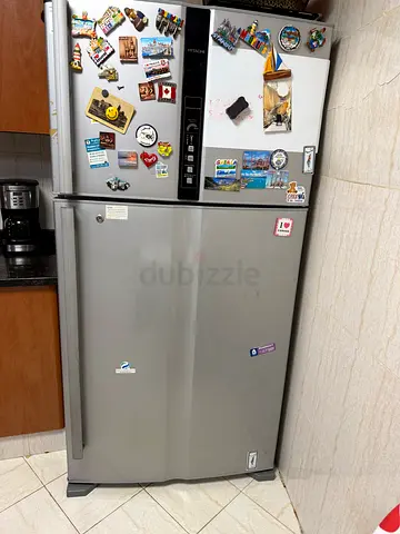 Silver double-door refrigerator in good working condition