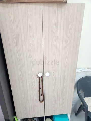 Light wood two-door wardrobe - compact storage