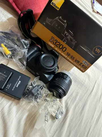 Nikon D3200 DSLR with 18-55mm VR Kit, charger and box hardly used couple of times.