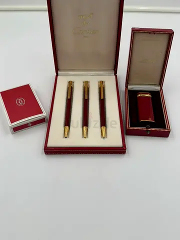 Cartier red and gold pen set with matching lighter in original boxes
