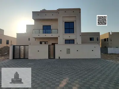 Villa for sale in Ajman, Al Helio area. 4 master bedrooms, majlis, living room, and maid's room. Ba
