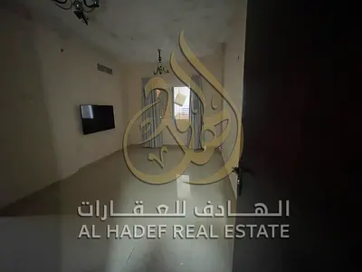 A modern room and lounge in Al Bu Tinah with an open view and a balcony