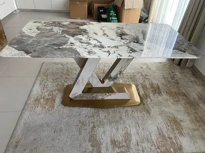 Marble-effect dining table with gold geometric base - like new