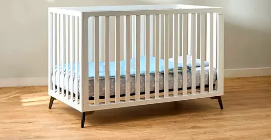 White Wooden Baby Crib - Modern Convertible Design, Good Condition. Available without the mattress.