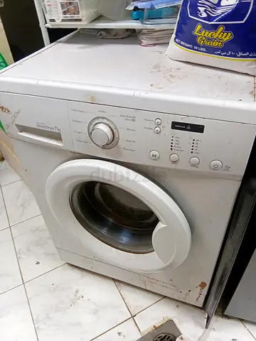 Used front-load washing machine - needs servicing, selling as-is