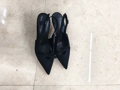 Black pointed slingback heels, size unknown - gently used