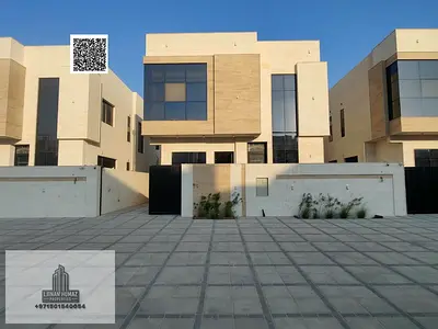 Villa for sale in Ajman, Al Helio area. 5 master bedrooms, majlis, living room, and maid's room. Bank financing available.
