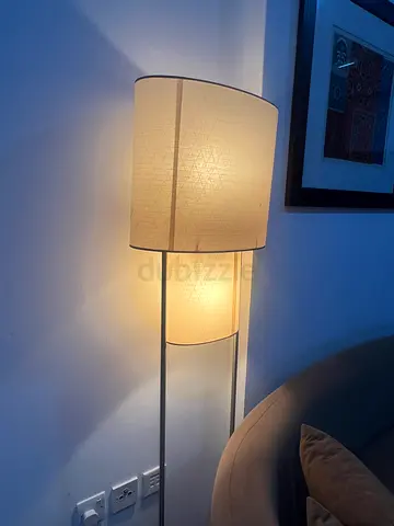 Double-shade floor lamp with fabric shades and metal stand