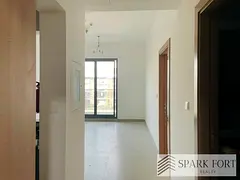 Bright 1BR Apartment | Monreve Building | Balcony & City View