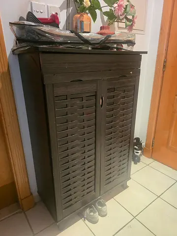 Dark wood shoe cabinet with louvered doors - good used condition