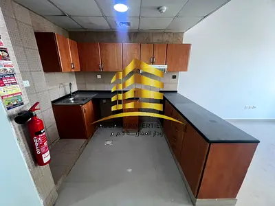 Studio for annual rent in Al Nuaimiya Tower C with private parking, 24k. Central air conditioning a