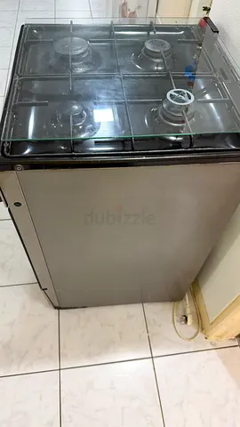 Used freestanding 4-burner gas stove with glass lid - good working condition