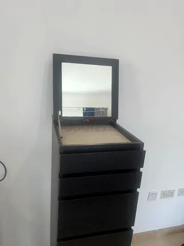 Tall dark wood dresser with flip-up mirror — 4 drawers