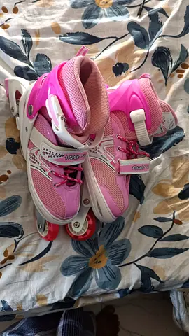 Pink adjustable inline roller skates - used, kids size (adjustable)