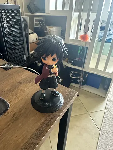 Anime collectible chibi figurine on display stand