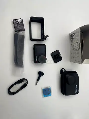 DJI Osmo Action 4 Action Camera - 99% New (Mint) with Accessories