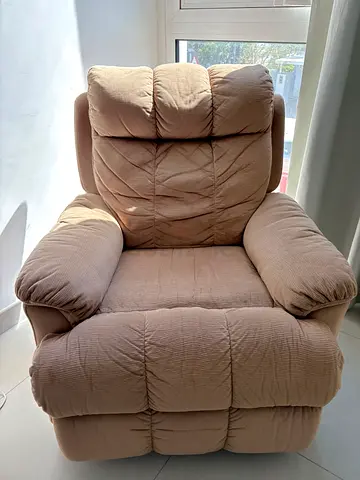 Comfortable beige recliner armchair - good condition