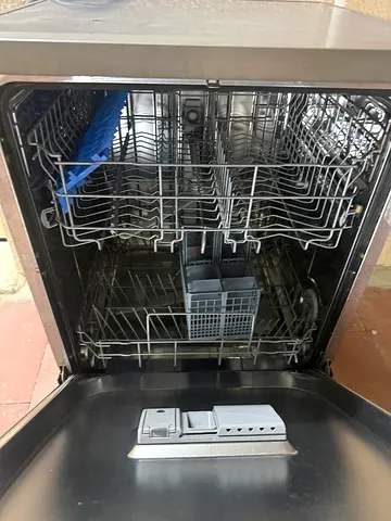 Used built-in stainless steel dishwasher in good working condition