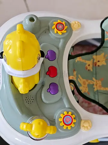 Urgent juniors brand Baby walker with activity tray - gently used