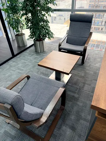Set of 2 Grey Fabric Lounge Chairs with Wooden Frames and Side Table