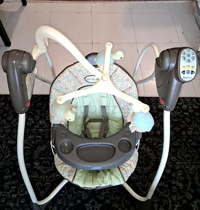 Graco baby swing with toy mobile - good used condition