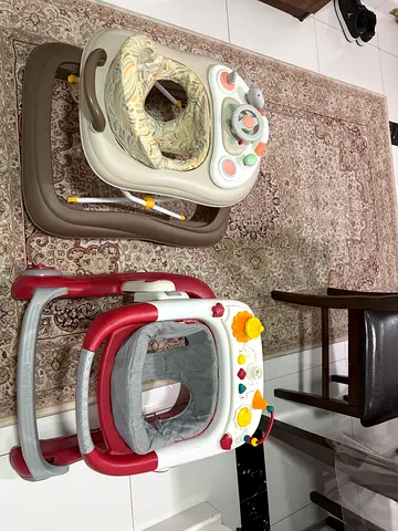 Light blue baby swing and 2 baby walkers