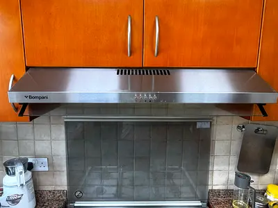 Bompani stainless steel kitchen chimney hood in good working condition 3 speed push button condition